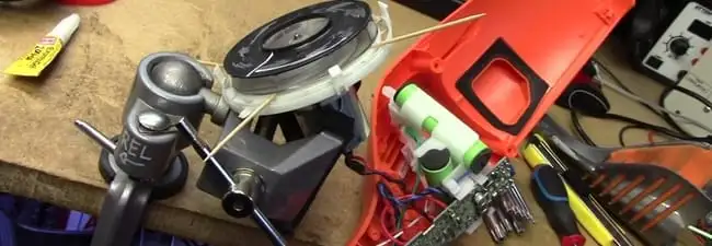 Vacuum cleaner repair parts and tools on a workbench in Rochester, NY